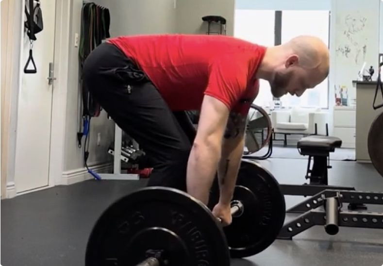 Drew Cotton lifting weights